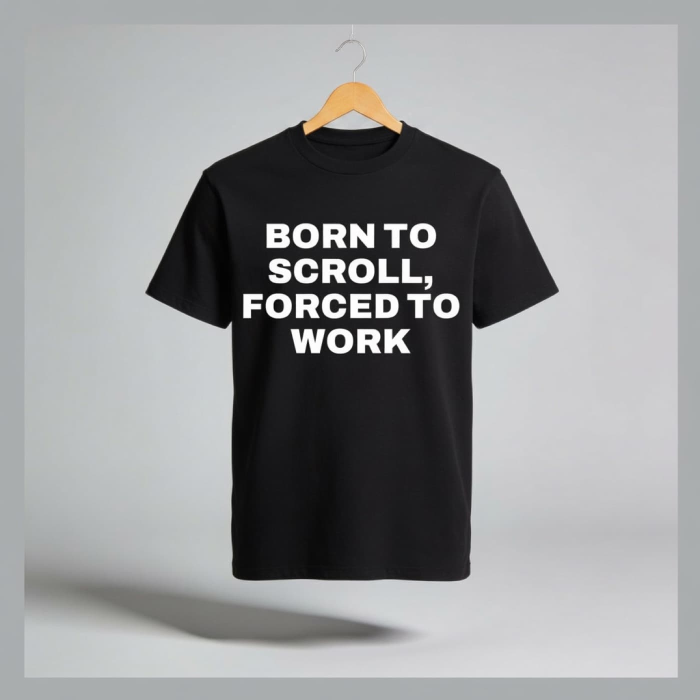 Born To Scroll, Forced To Work t-shirt on a hanger