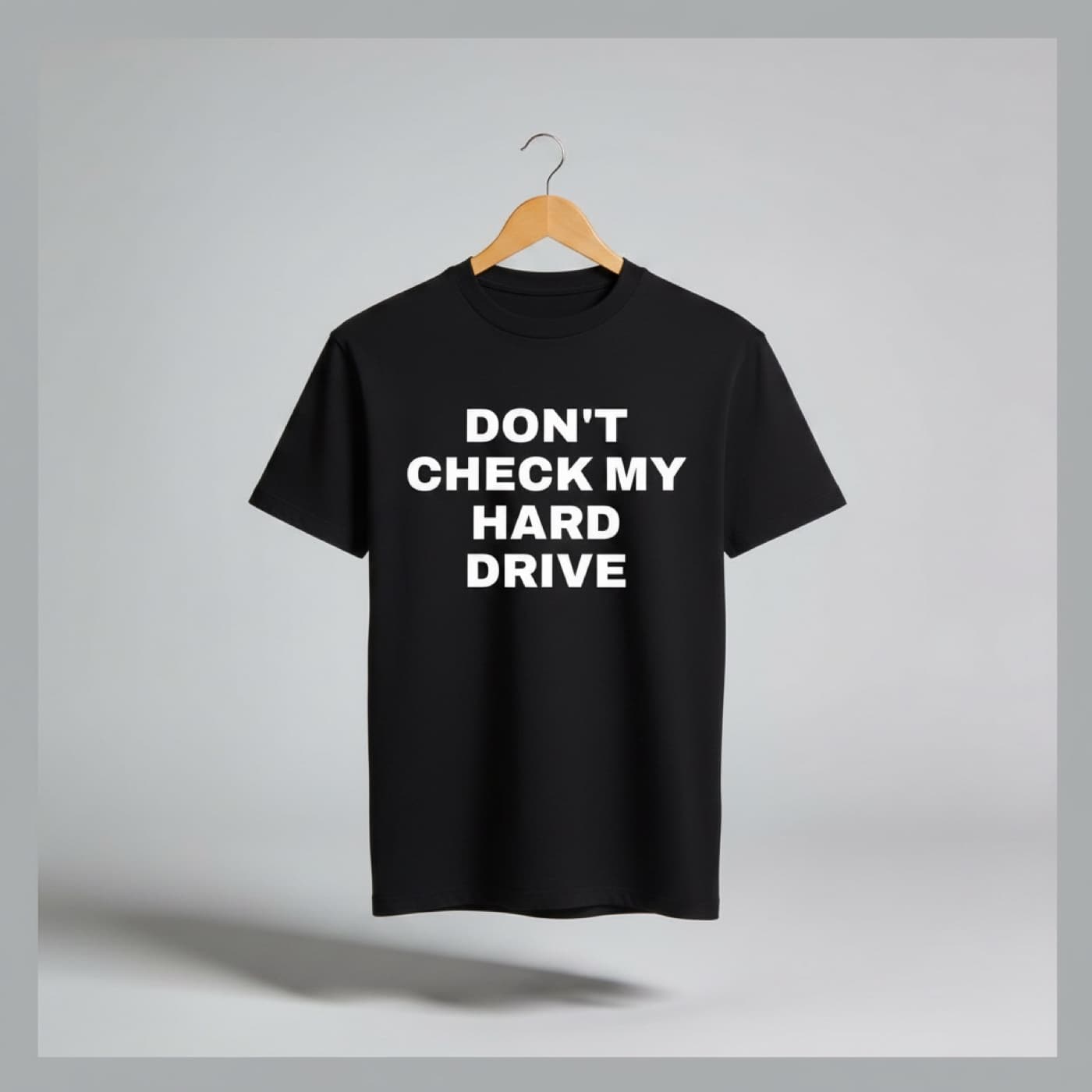 Don't Check My Hard Drive t-shirt on a hanger