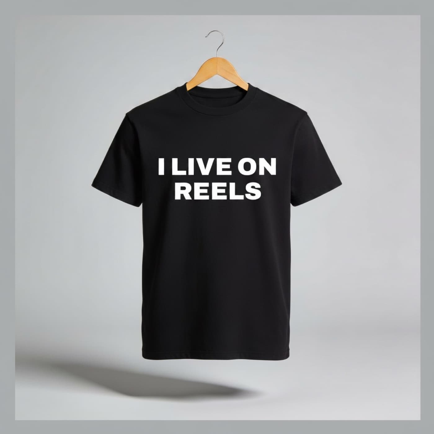 I Live on Reels t-shirt on a hanger